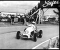 December 1959 Sebring, FL.
US Grand Prix Driver Rodger Ward on the road course in the Ralph Wilke #1 Leader Card Midget. Ralph installed a two speed gear box with a clutch so Ward could shift in the turns.
