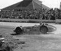 Milwaukee Mile 1960 Chuck Stevenson spins the Leader Card #65 Roadster. This car is the Leader Card Roadster that Rodger Ward won the 1959 Indianapolis 500.