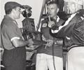 Sept 16, 1956 Bob Wilke hands driver Jimmy Bryan the Leader Card Trophy for winning the Milwaukee Mile USAC 250 Mile Stock Car Race.
