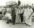 August 29, 1959 Milwaukee Mile. Victory Lane. Driver Rodger Ward led 80 laps to win the 100 mile USAC midget race. He took home a check for $1056.00 for his effort. L-R Bob Wilke, Ward, Co Owner Ralph Wilke, Billy Wisnewski & Co Owner Gus Wesell.