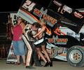 TMAC does the customary meet and greet with the trophy girl at Eldora on 6-20-09 (Mike Campbell Photo)