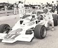 July 28, 1974  Elkhart Lake WI, Road America. Driver Mike Mosley poses with his Leader Card, Loadstar Formula 5000 Lola.

