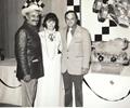 Indianapolis 1974 Leader Card Racers cocktail party at the Speedway Hotel. J.C. Aggie Agajanian sponsor of the Leader Card Lodestar #98 Indy Car (left).  along with Car Owner Ralph Wilke (right) & Ralphs wife Marilyn Skeeter.
