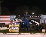 Moran survives pair of late race challenges to win