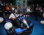 The Premier of NSW Mike Baird go-karting in Albion Park