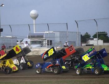 A heat race pace lap with the McCool Junction water tower in the background
