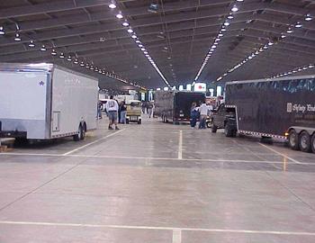 Haulers make their way inside the Tulsa Expo Center to get parked on Tuesday prior to the Chili Bowl.