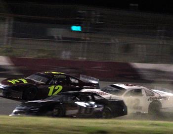 #10 Dustin Walters gets in the grass while #12w Ryan Walters and #22m David Miller try to avoid him.