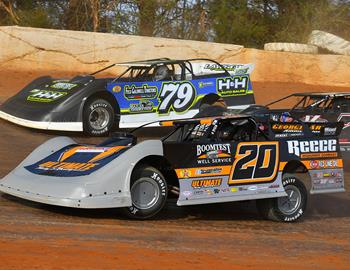 Jimmy Owens battling Ross Bailes at 411 Motor Speedway on March 10. (Michael Moats image)