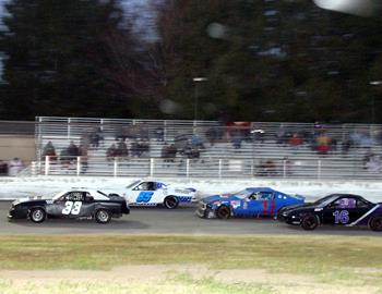 #33 Colton Kinsey leads #85 C.J. Dalton, #11 Sam Brown and #16 Eric OFerrall in mini stock action.