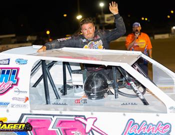Tom climbing out of his car in Victory Lane on July 13 at Dacotah Speedway.