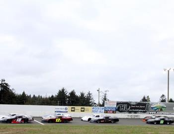 Late models are lined up for the start of the race.