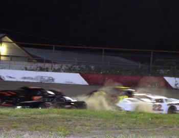 Dust gets kicked up in the late model main event.
