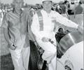 1959 The newly established Leader Card Racers Team. AJ Watson and driver Rodger Ward stand by the Leader Card Duo car.
