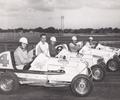 1939 Car Owner Bob Wilke with his stable of midgets.
Drivers L-R Myron Fohr, Ray Richards, Pete Neilsen & Gus Klingbiel. 