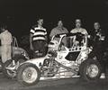 September 1, 1984 Tri-City Speedway in Granite City, IL. L-R Greg Wilke, Mark Wilke, Troy Richards & Driver Ricky Hood. Hood who ran the bottom of the track dominating the main event until being passed with a few laps remaining by Tom Bigelow who found that the track started taking rubber in the middle grove, Hood ran second in his Wilke Racers Pabst Blue Ribbon Beer, Autocraft VW. This was the second time Hood ran a midget, the first time was the night before at Little Springfield where Hood fo