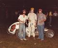 1981 Sun Prairie, WI
L-R crew member Pat Moran, Driver Dean Erfurth & Car Owner Mark Wilke enjoying the sponsors product after winning the feature event. Its Miller Time!!
