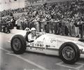 1960 Indianapolis 500. Driver Chuch Stevenson sits in his #65 Leader Card 500 Roadster. Chuck started 9th and finish 15th, this is the same car that Rodger Ward won the 500 in the year before. Sadly its the same car that Tony Bettenhausen was killed in on May 12,1961 while testing the car for friend Paul Russo.   
