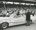 1968 Indianapolis 500 Victory Lap. Bobby Unser and wife Norma seated in the pace car with family. Car Owner Bob Wilke (foreground) waits his turn.
