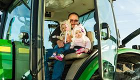 Great Nieces first Tractor Ride with Grandpa