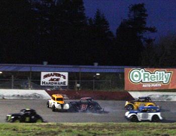 Cars get together in the Legends division main event.