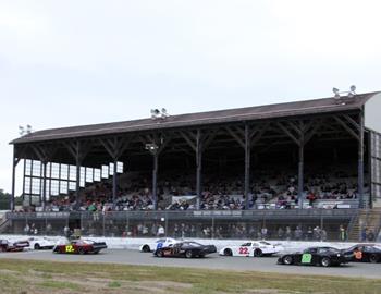 The late models race down the front straightaway.