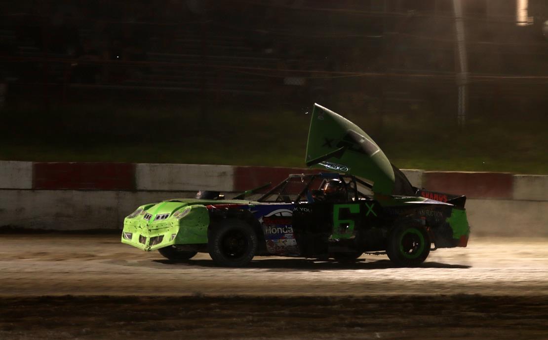 Devin Bell survives 75 laps of wild action in the...