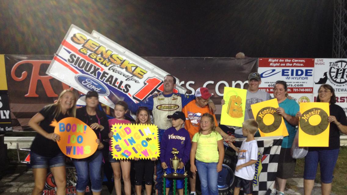 Mark and some of his fans celebrate his 100th win at River Cities Speedway