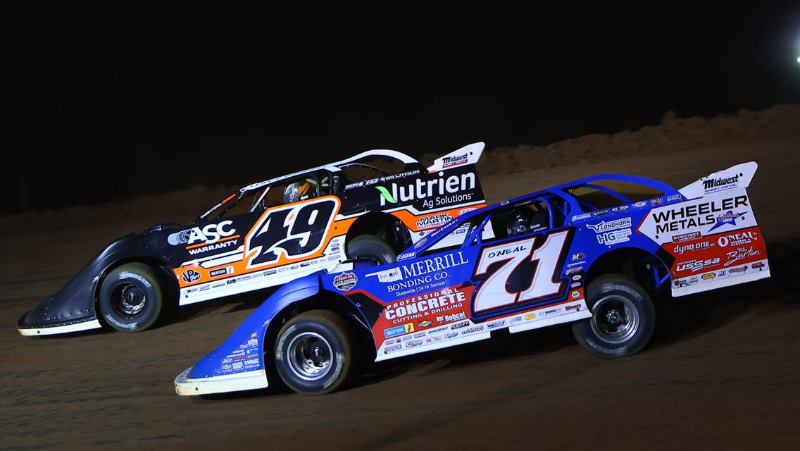Jonathan Davenport (49) and Hudson O&#39;Neal (71) battle at Spoon River Speedway on May 7, 2025