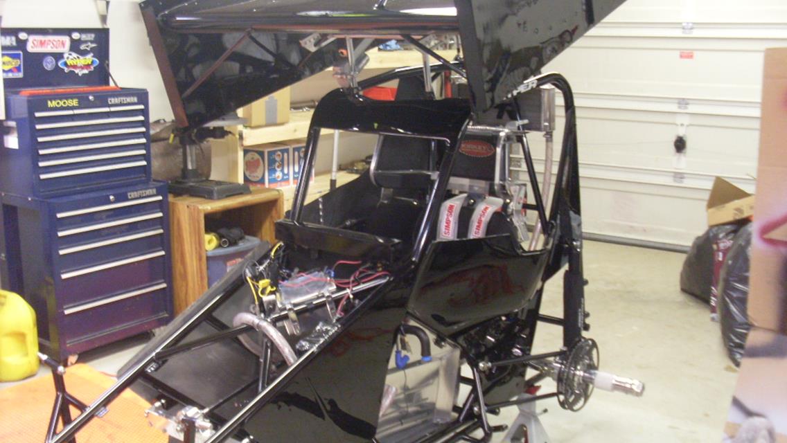 A work in progress, getting the car ready for the 2012 season, this year the wings are powder coated all black.