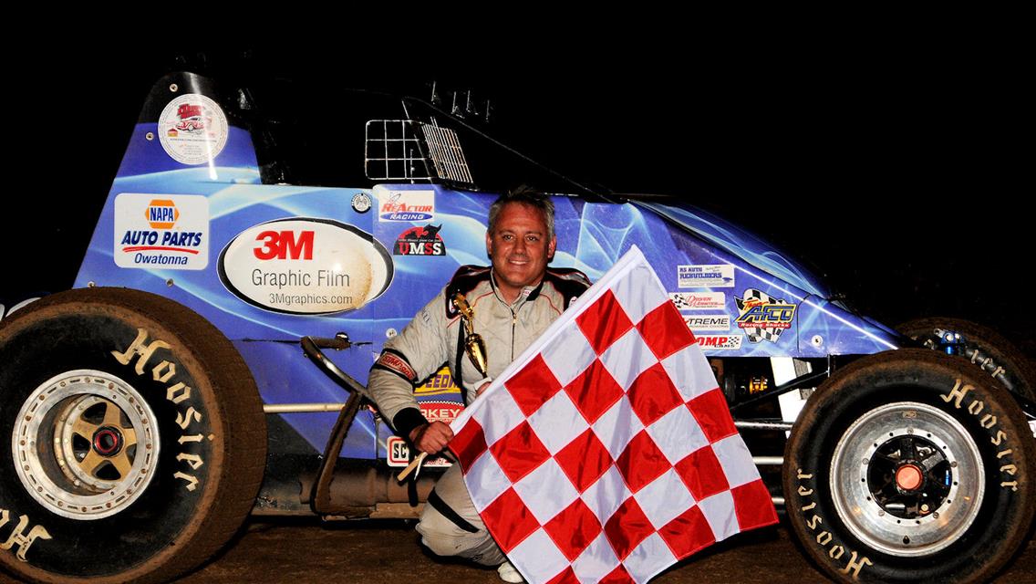 Johnny Parsons III with the unique red/white checkered flag in victory lane at SCVR Aug 19.