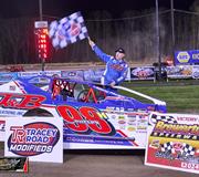 Phelps Outduels Sears for Opening Night Feature win