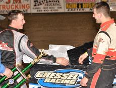Ryan Gustin (right) is congratulated by Jon Tesch (left) after Gustin won his first USMTS main event with Gressel Racing on March 26, 2010. (Chad Ebel Photo)