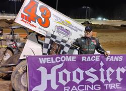 SMITH SLIDES TO SECOND USCS WIN OF