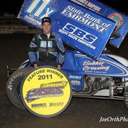 Gregg Bakker in Speedway Motors ASCS Midwest victory lane after winning Saturday night&amp;#39;s 25-lap feature event at Junction Motor Speedway in McCool Junction, NE. (Joe Orth photo)