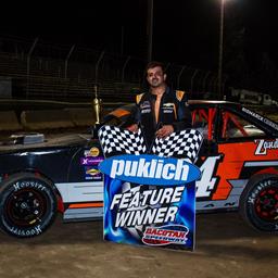 HELLMAN EDGES CARTER AT THE FINISH LINE