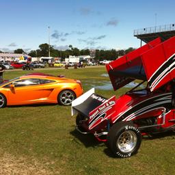 The #9 with fresh paint and graphics next to a Lamborghini at the BIR Powercruise.
