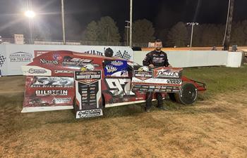 Cade Dillard parks Modified in victory lane at Ark-La-Tex Speedway