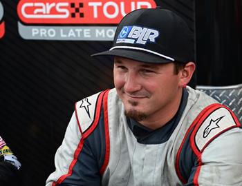 Brandon Lopez signs autographs before the CARS Tour Firecracker 265 at Caraway Speedway (Sophia, NC) on July 3, 2024.