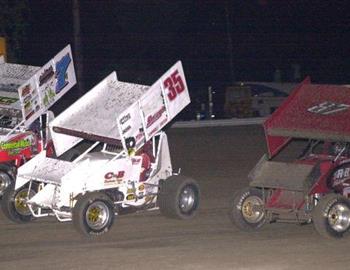 Brian McClelland (87), Greg Rilat (35) and Kevin Ramey (7m) battle for position in the feature