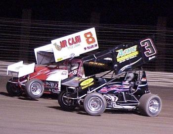 Ernie Ainsworth (8) and A.G. Rains battle in heat race action