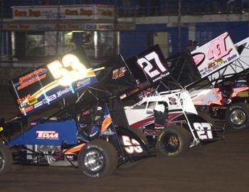 Jack Dover (53), Andy Shouse (27) and Jason Johnson (41) lead the three-wide salute