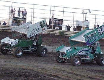 A pair of 94 cars, Cody Branchcomb (94) and Natalie Sather (94s), battle in heat race action