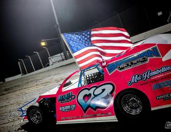 Tanner Mullens carries the American flag. (Tyler Rinken photo)