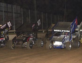 Justin Melton (11), Brian McClelland (87) and Donnie Ray Crawford (91) lead the three-wide salute