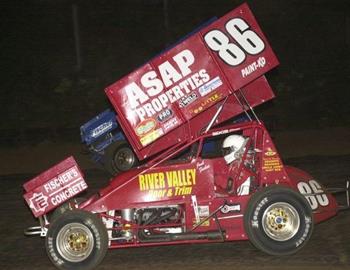 Josh Fisher (86) races underneath Jesse Hockett