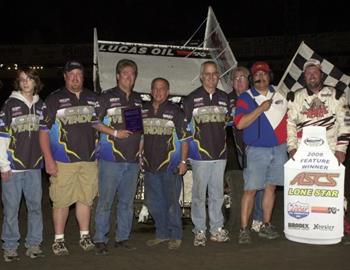 Kevin Ramey and pit crew enjoy victory lane.