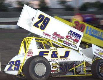 Travis Rilat (29) races outside Joe Miller (30)