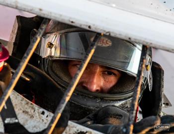 Carlos Ahumada Jr. in the cockpit of his No. 65x Modified. (Tyler Rinken photo)