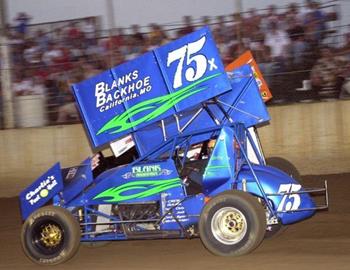 Tyler Blank races underneath another car